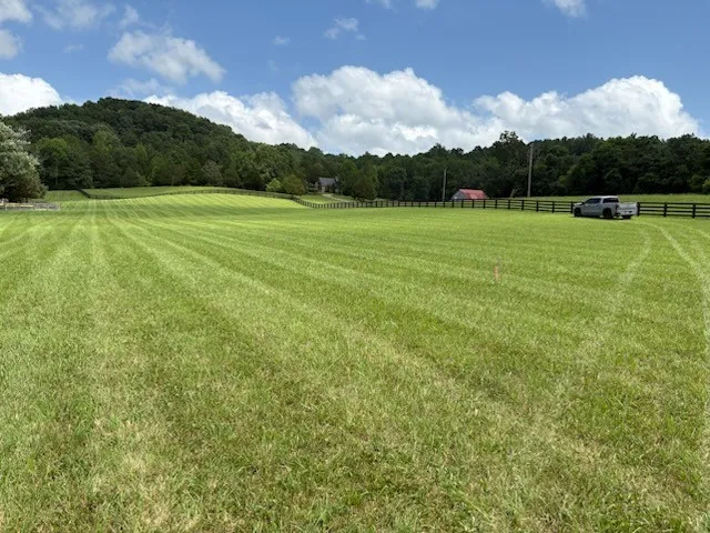 a view of a golf course with a lake