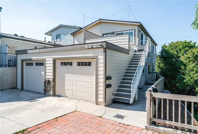 a view of a house with a door and wooden walls