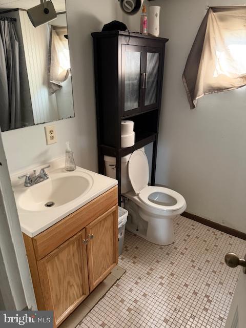 1810 Ridgeview Drive Coatesville, PA 19320 - Photo 5 of 6 a bathroom with a toilet sink and mirror