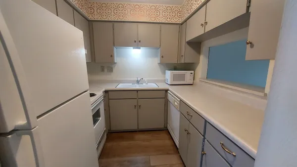 a kitchen with a sink and cabinets