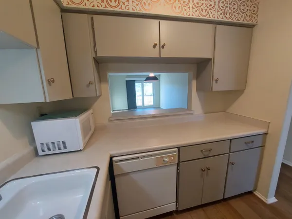a kitchen with cabinets and a sink