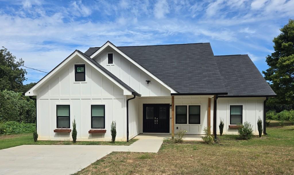 a front view of a house with a yard