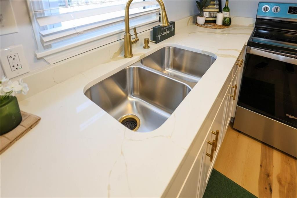 1745 Rockbridge Road Northwest Conyers, GA 30012 - Photo 12 of 46 a close view of sink and tap