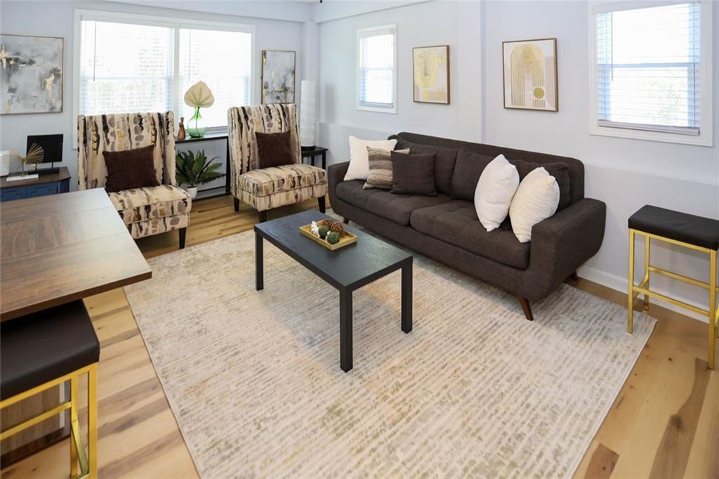 1745 Rockbridge Road Northwest Conyers, GA 30012 - Photo 17 of 46 a living room with furniture and a fireplace