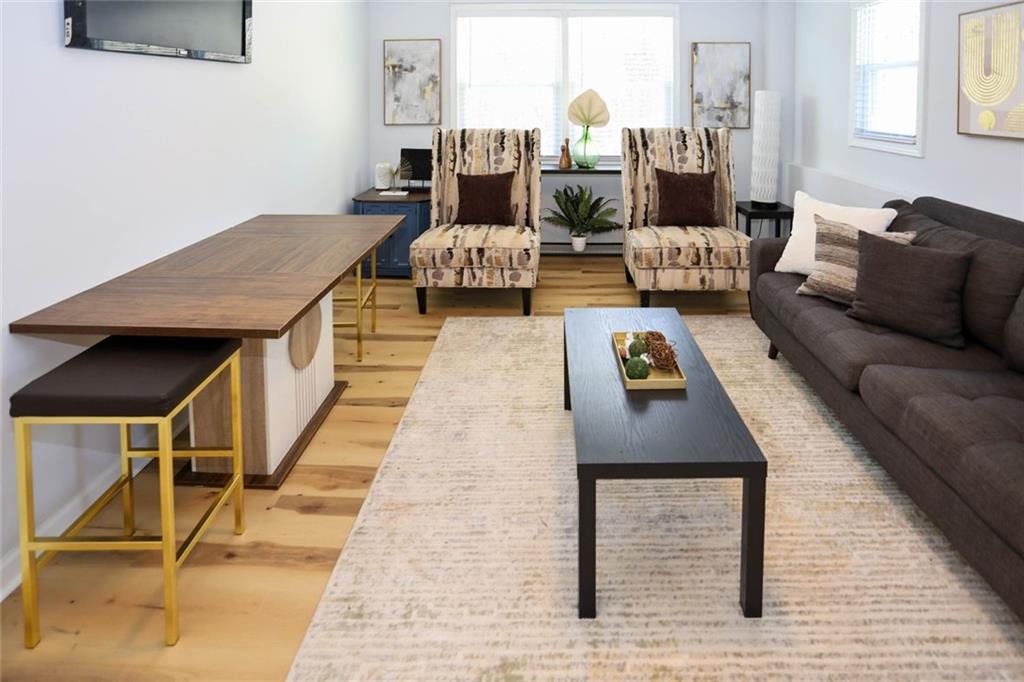 1745 Rockbridge Road Northwest Conyers, GA 30012 - Photo 18 of 46 a living room with couch and a table