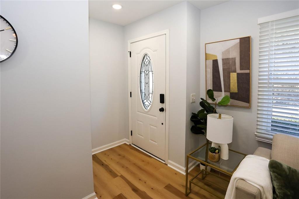 1745 Rockbridge Road Northwest Conyers, GA 30012 - Photo 2 of 46 a room with furniture and a mirror