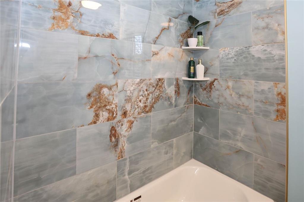 1745 Rockbridge Road Northwest Conyers, GA 30012 - Photo 23 of 46 a bathroom with a shower