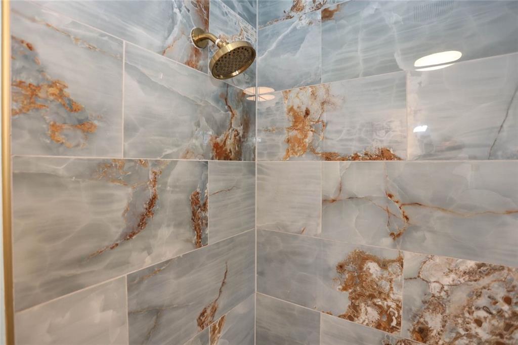 1745 Rockbridge Road Northwest Conyers, GA 30012 - Photo 24 of 46 a bathroom with a shower