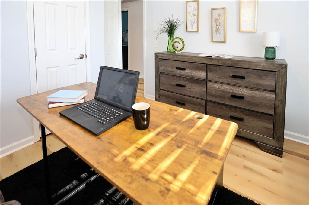 1745 Rockbridge Road Northwest Conyers, GA 30012 - Photo 25 of 46 a living room with couch and a table