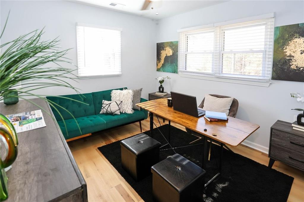 1745 Rockbridge Road Northwest Conyers, GA 30012 - Photo 27 of 46 a living room with furniture rug and window