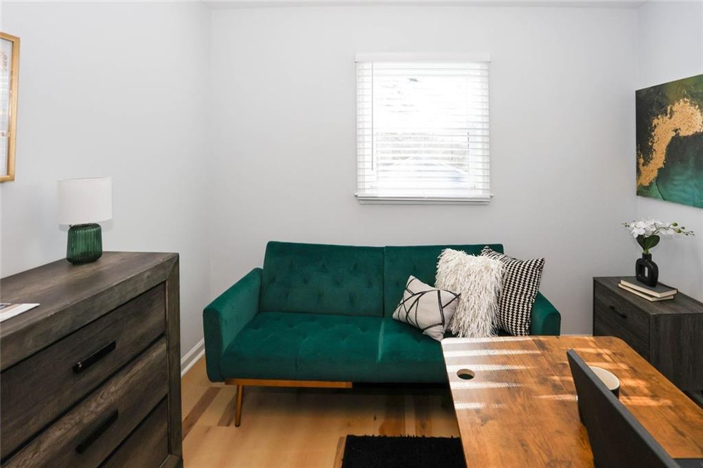 1745 Rockbridge Road Northwest Conyers, GA 30012 - Photo 28 of 46 a living room with furniture and a window