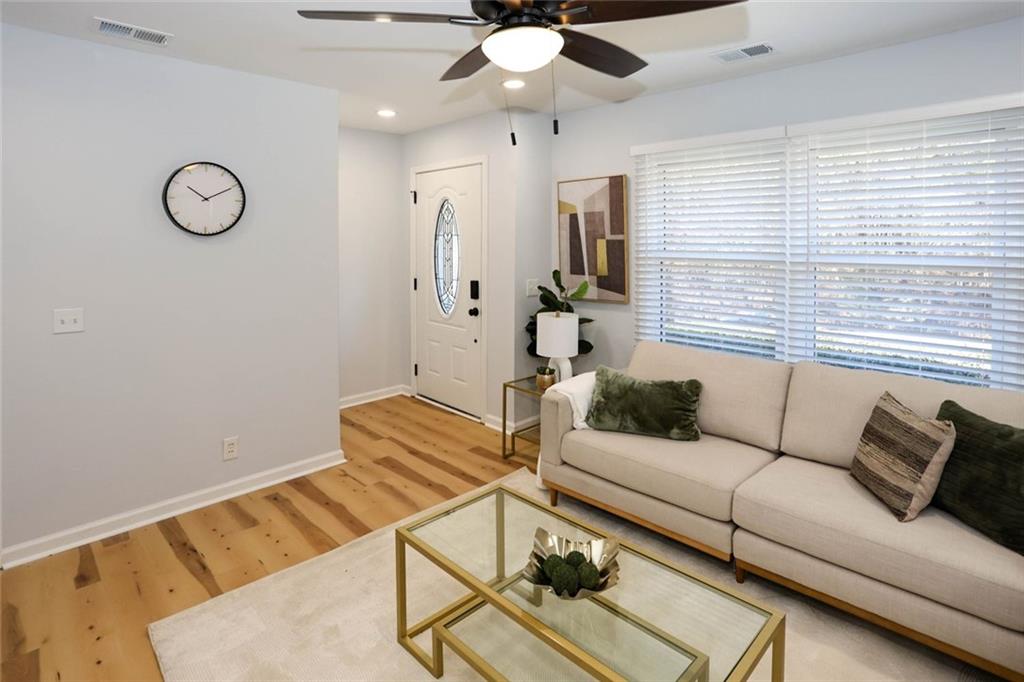 1745 Rockbridge Road Northwest Conyers, GA 30012 - Photo 3 of 46 a living room with furniture and a large window