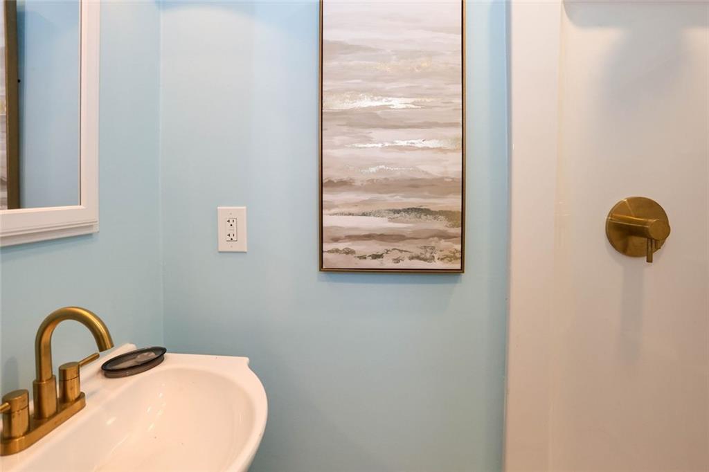 1745 Rockbridge Road Northwest Conyers, GA 30012 - Photo 32 of 46 a close view of a sink and tap