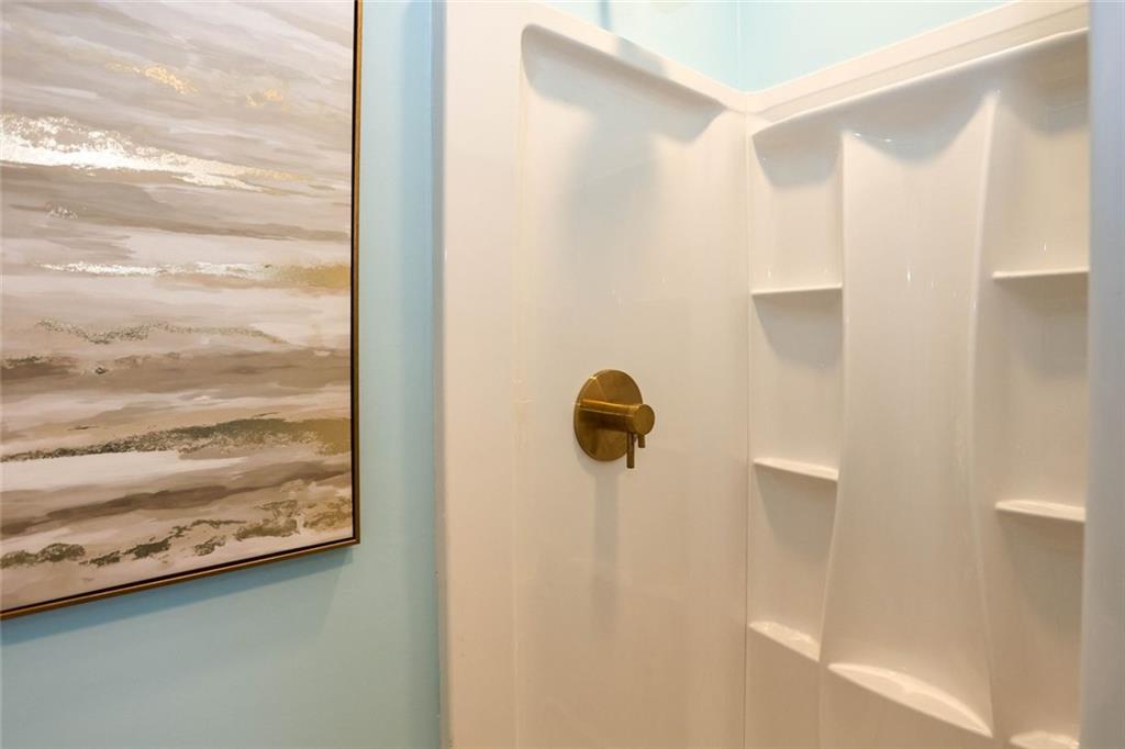 1745 Rockbridge Road Northwest Conyers, GA 30012 - Photo 34 of 46 a bathroom with a shower