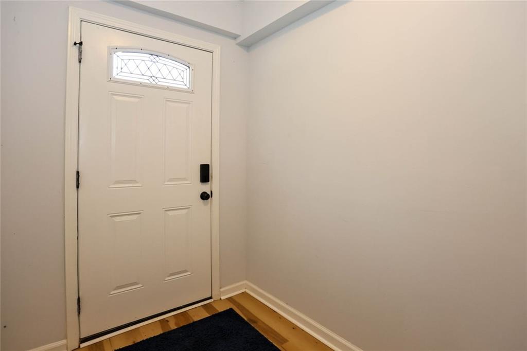 1745 Rockbridge Road Northwest Conyers, GA 30012 - Photo 37 of 46 a view of a small space with wooden floor and a window