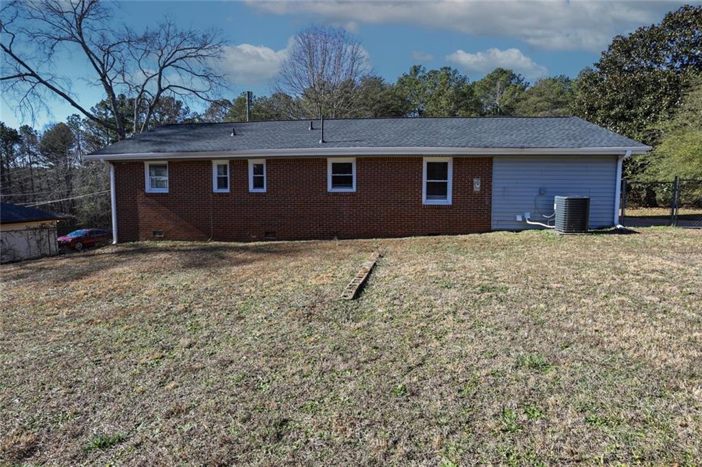 1745 Rockbridge Road Northwest Conyers, GA 30012 - Photo 40 of 46 a front view of a house with a yard