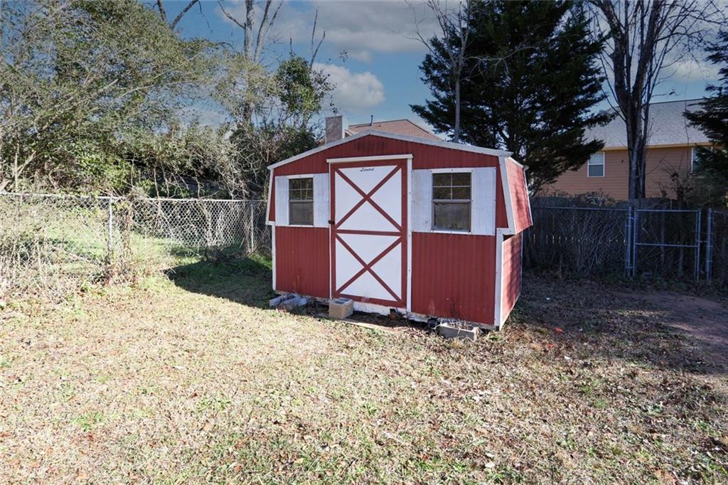 1745 Rockbridge Road Northwest Conyers, GA 30012 - Photo 43 of 46 a backyard of a house with lots of green space