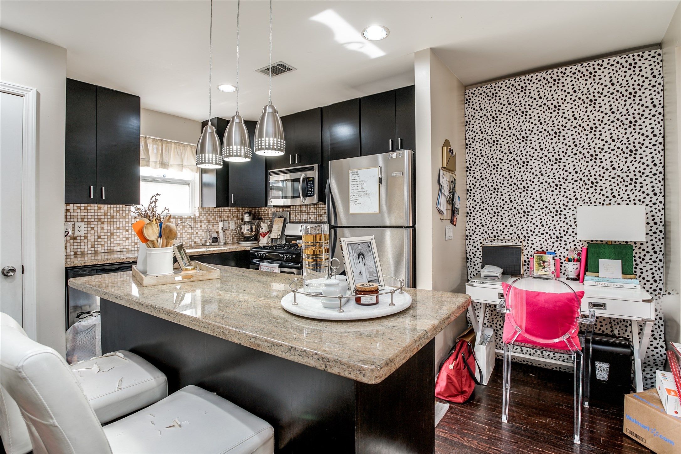 910 West 9th Street Houston, TX 77007 - Photo 8 of 20 a kitchen with stainless steel appliances kitchen island granite countertop a dining table chairs and a refrigerator