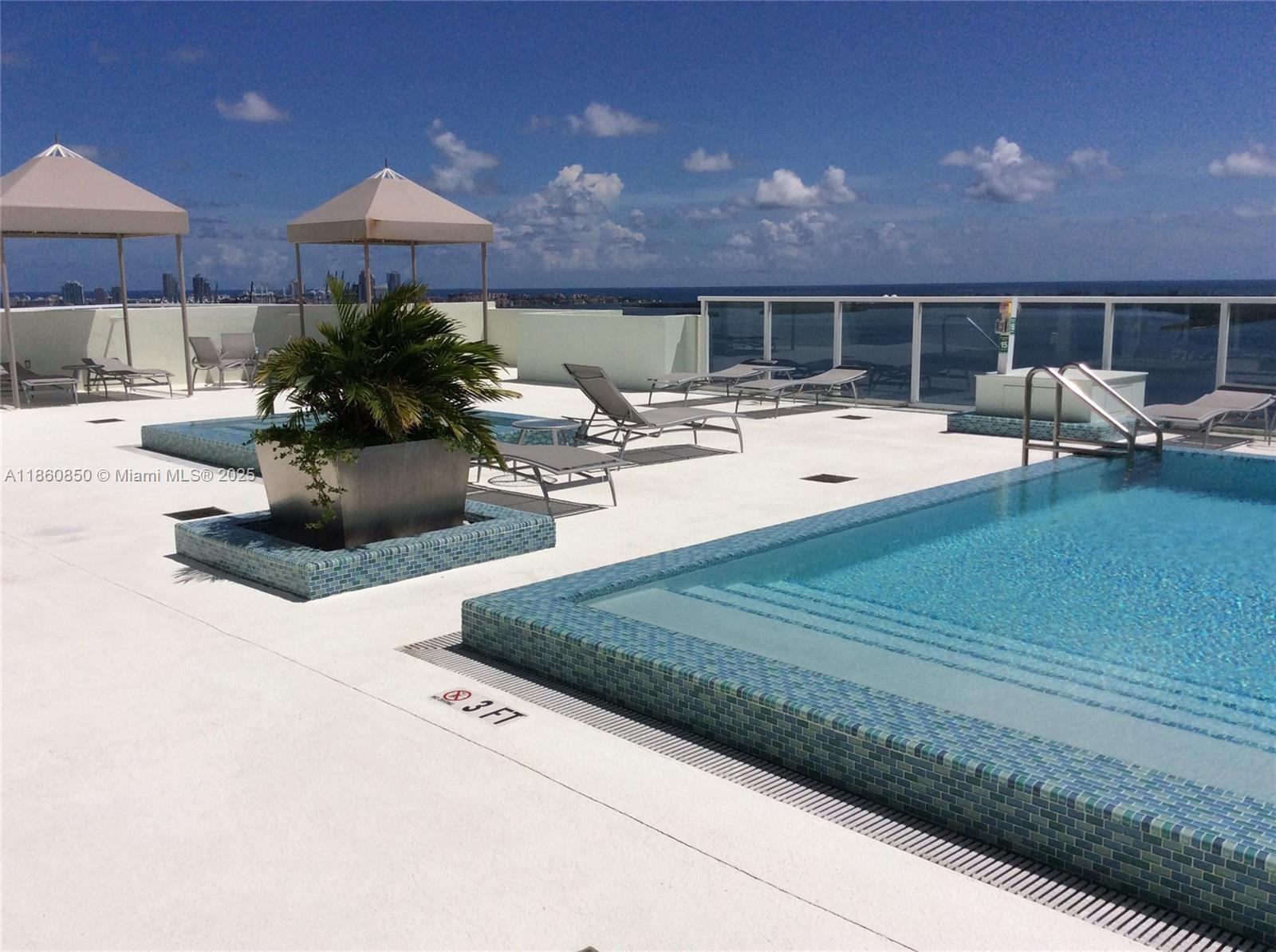 218 Southeast 14th Street, Unit 1508 Miami, FL 33131 - Photo 12 of 12 a swimming pool with outdoor seating and yard