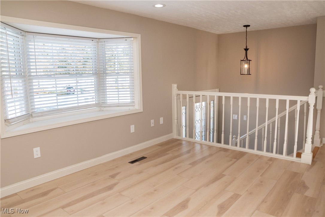 158 Morningside Road Niles, OH 44446 - Photo 6 of 36 Unfurnished room featuring hardwood / wood-style flooring