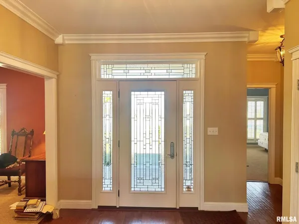 a view of front door with wooden floor