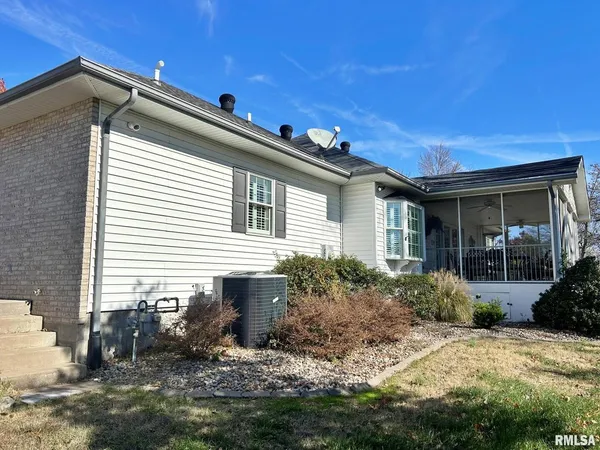a front view of house with yard outdoor seating and barbeque