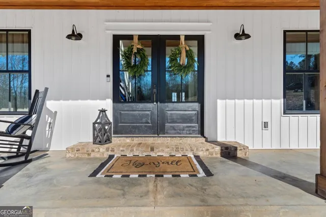 a living room with furniture fireplace and flat screen tv