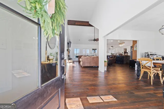 a kitchen with kitchen island granite countertop a sink and a stove