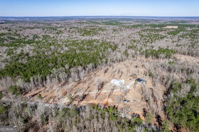 a view of a house with a snow in the yard