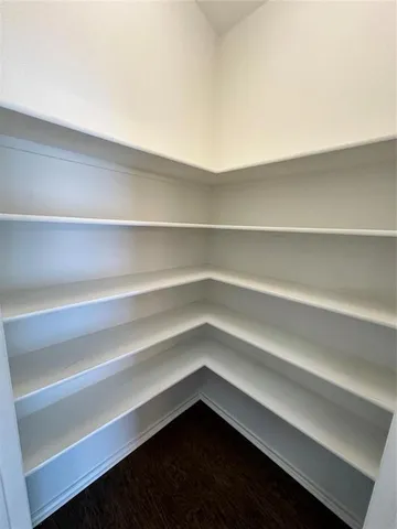 a cabinet with an empty shelf
