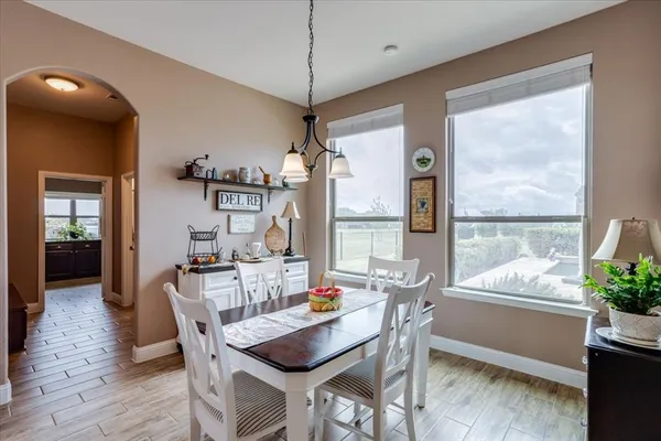 a dining room with furniture and window