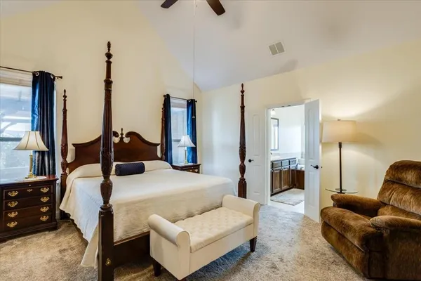 a bed room with furniture and a chandelier