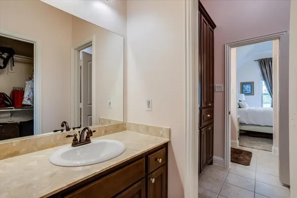 a bathroom with a sink and a mirror