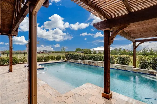 a view of a swimming pool with a porch