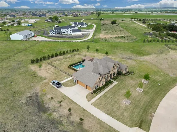 a view of a swimming pool with a yard