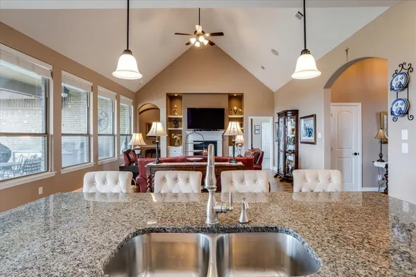 a view of living room with granite countertop furniture and fireplace