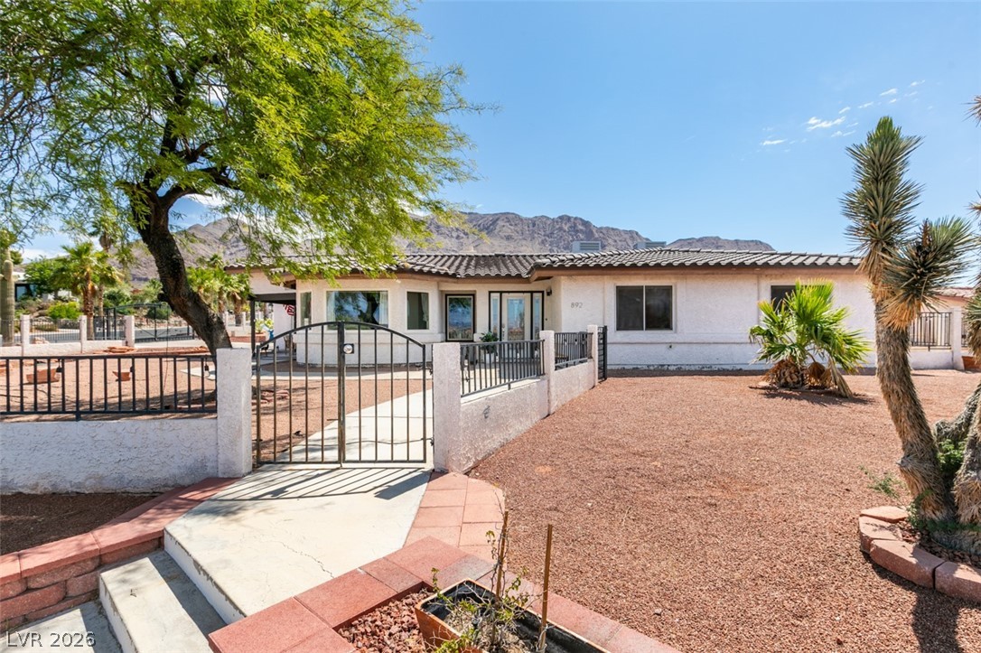 892 North Hollywood Boulevard Las Vegas, NV 89110 - Photo 61 of 81 This charming desert home offers tranquil mountain views and a private, fenced yard.