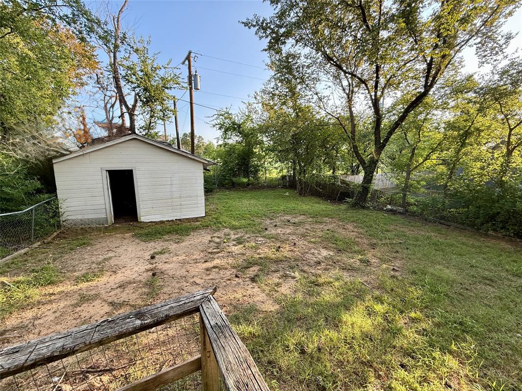 428 East Elm Street Denison, TX 75021 - Photo 18 of 18 a view of a house with a yard