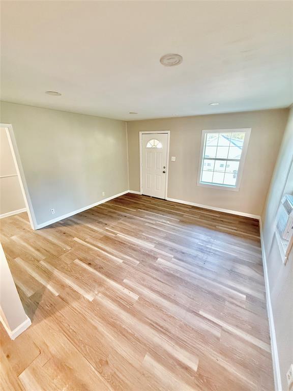 428 East Elm Street Denison, TX 75021 - Photo 2 of 18 a view of an empty room and window