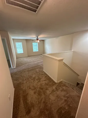a view of storage and utility room with empty racks