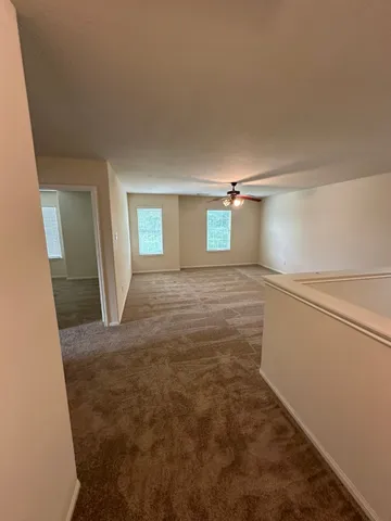 a view of hallway with natural light