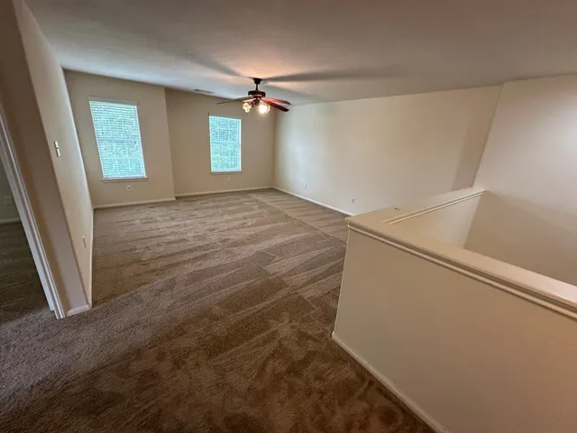 a view of empty room with windows
