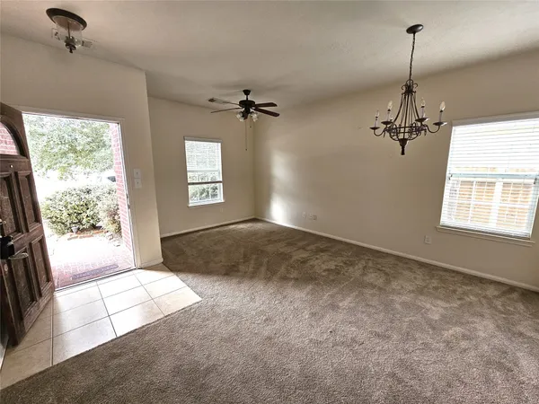 a view of a windows and chandelier in a room
