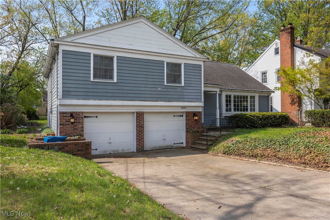 Tri-level home featuring a lovely wooded front and back yard, large windows and five good sized bedrooms.  A family room, basement, 2.5 baths and a two car garage.
