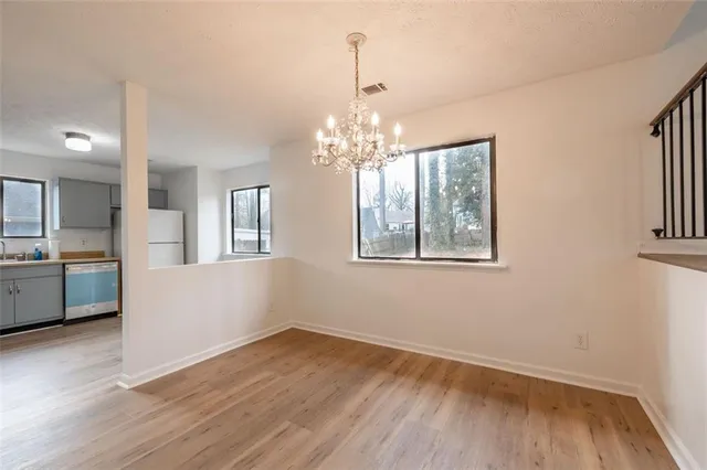 a view of livingroom and kitchen with hardwood floor