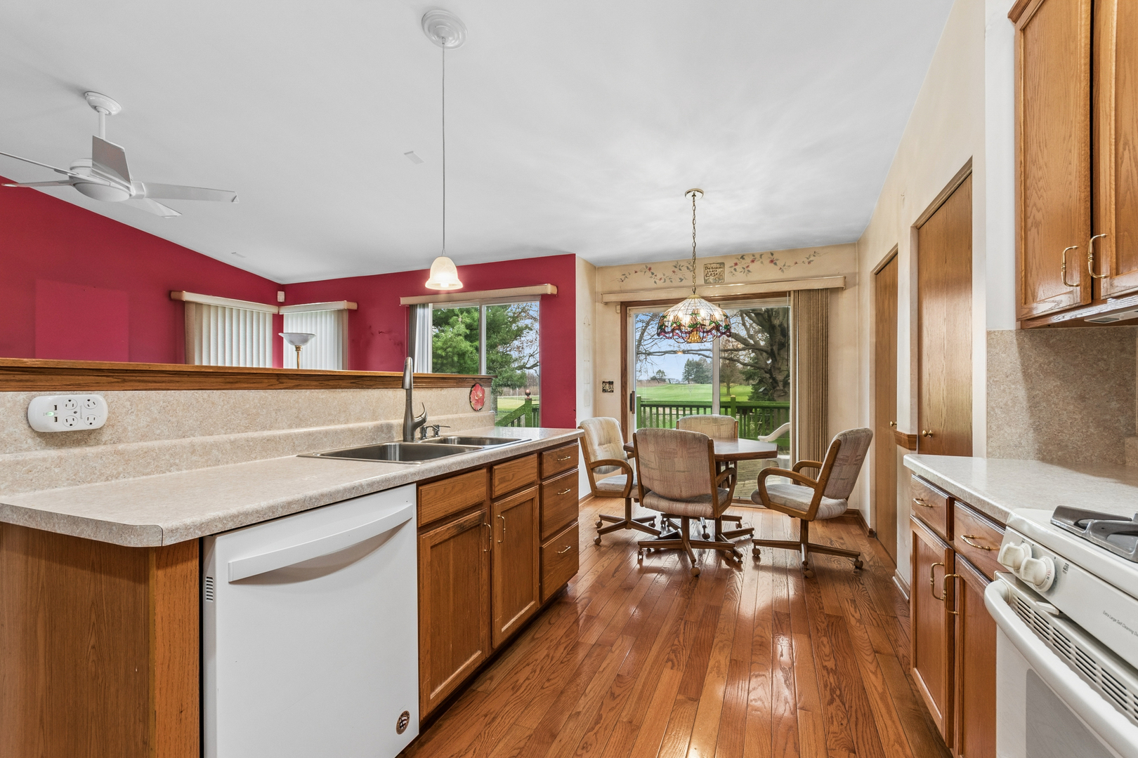 1921 Baldwin Way Bolingbrook, IL 60490 - Photo 14 of 20 a kitchen with a table chairs stove and wooden floor