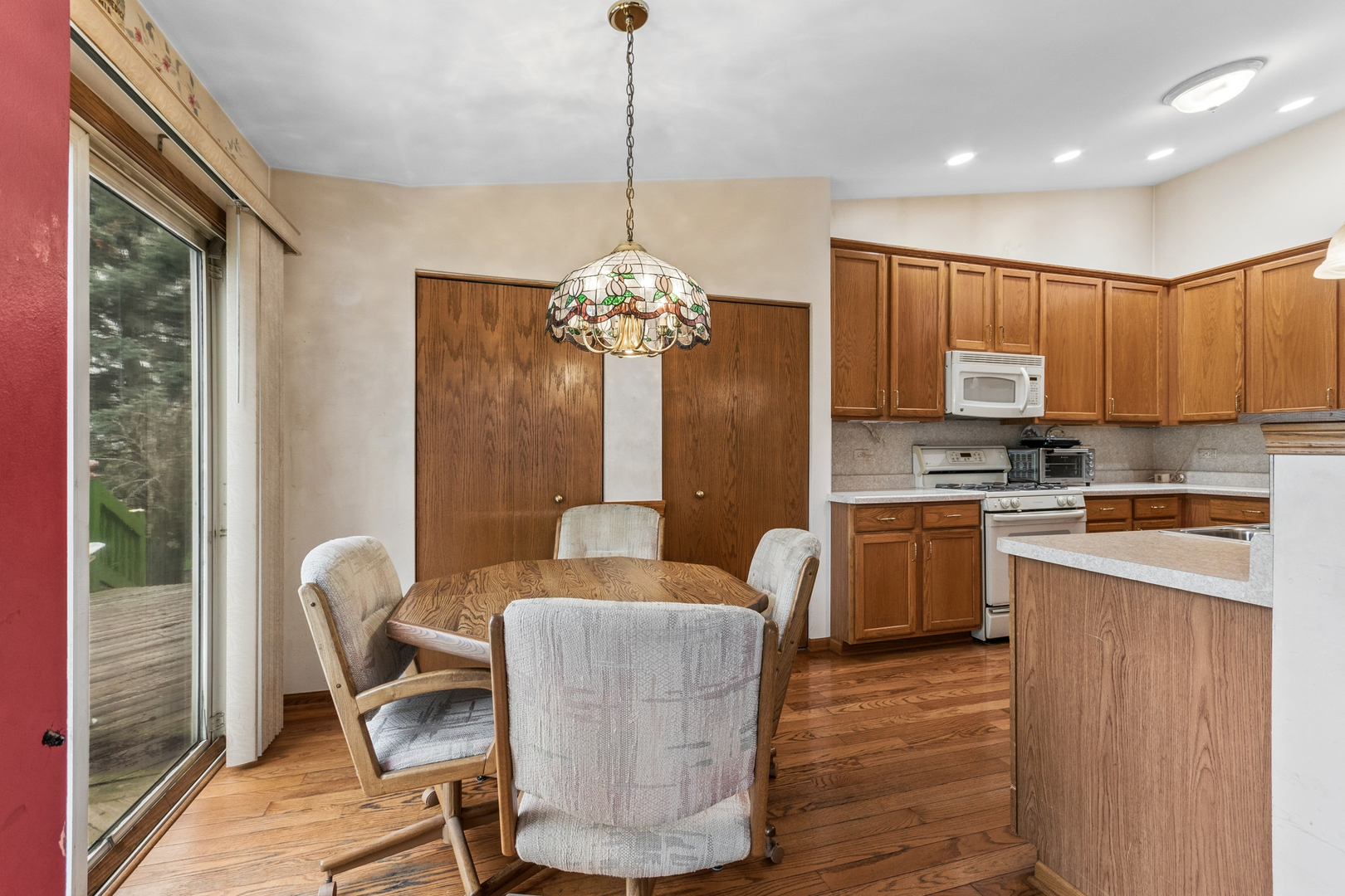 1921 Baldwin Way Bolingbrook, IL 60490 - Photo 15 of 20 a living room with kitchen island furniture and a chandelier