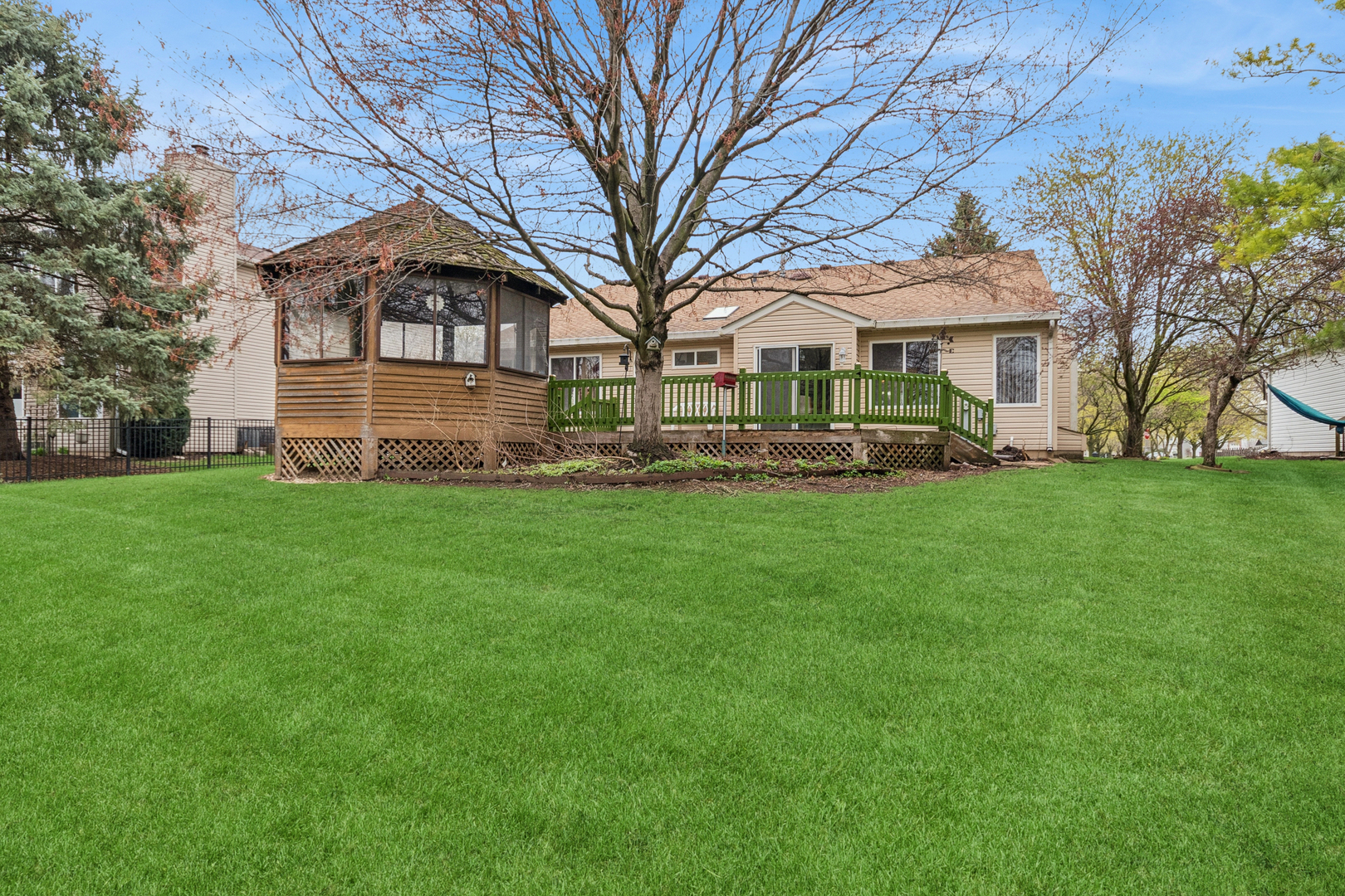 1921 Baldwin Way Bolingbrook, IL 60490 - Photo 20 of 20 a front view of a house with a garden and trees