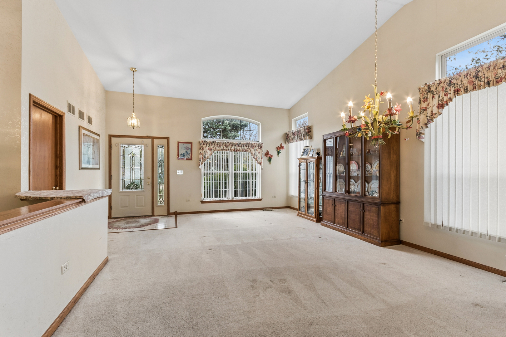 1921 Baldwin Way Bolingbrook, IL 60490 - Photo 4 of 20 a large room with chandelier front door and windows