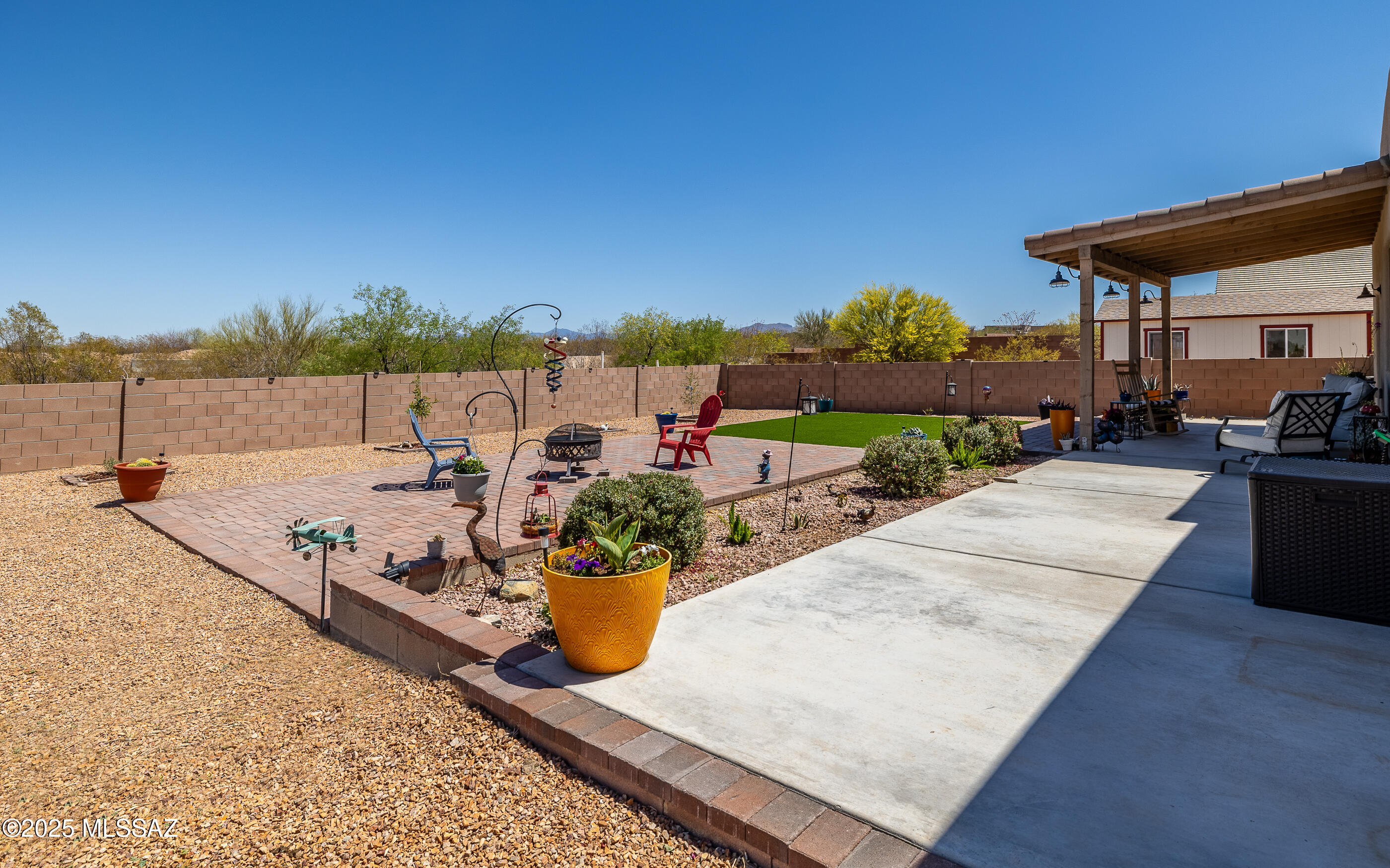 12123 Creosote Valley Road Vail, AZ 85641 - Photo 28 of 46 a view of a backyard with sitting area